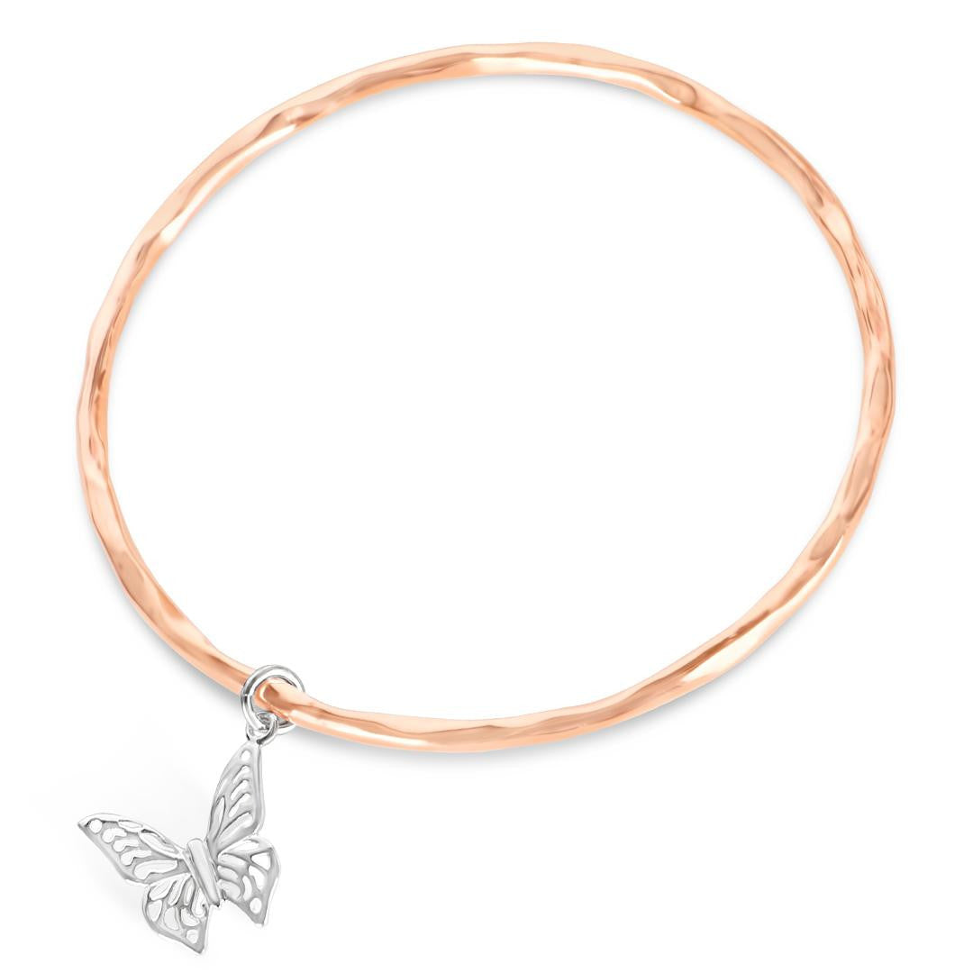 rose gold bangle with silver butterfly charm attached 