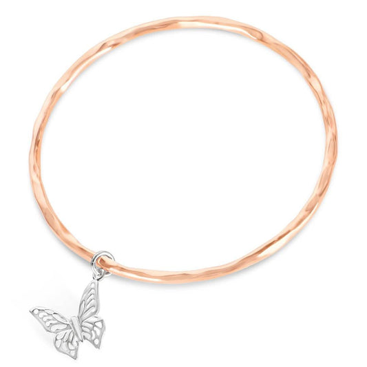 rose gold bangle with silver butterfly charm attached 