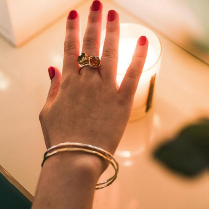 close up of model wearing citrine cocktail ring in gold