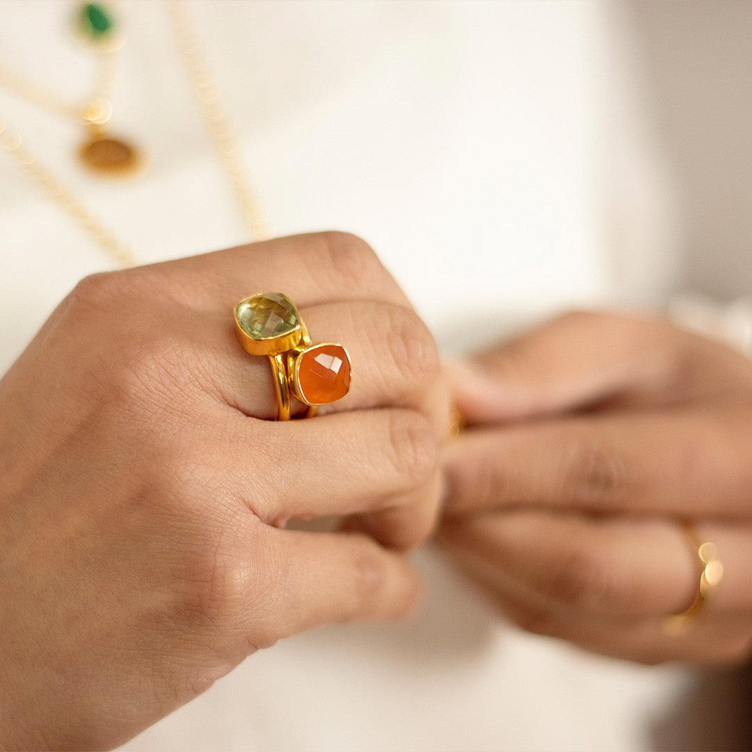close up of of model wearing carnelian cocktail ring