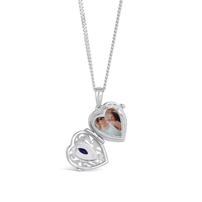 opened sapphire heart locket in silver with photo inside
