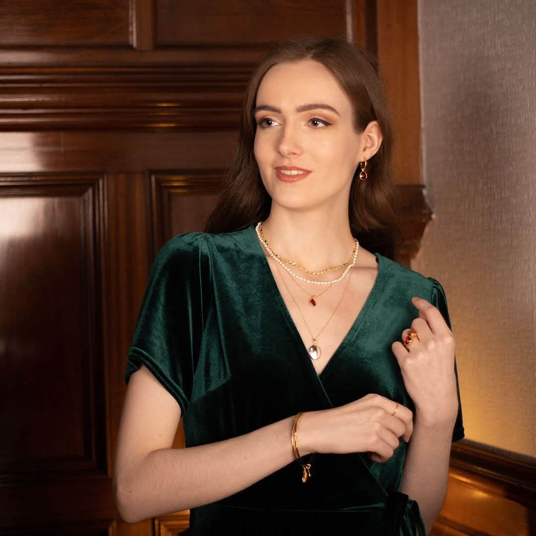 model wearing diamond oval locket in gold