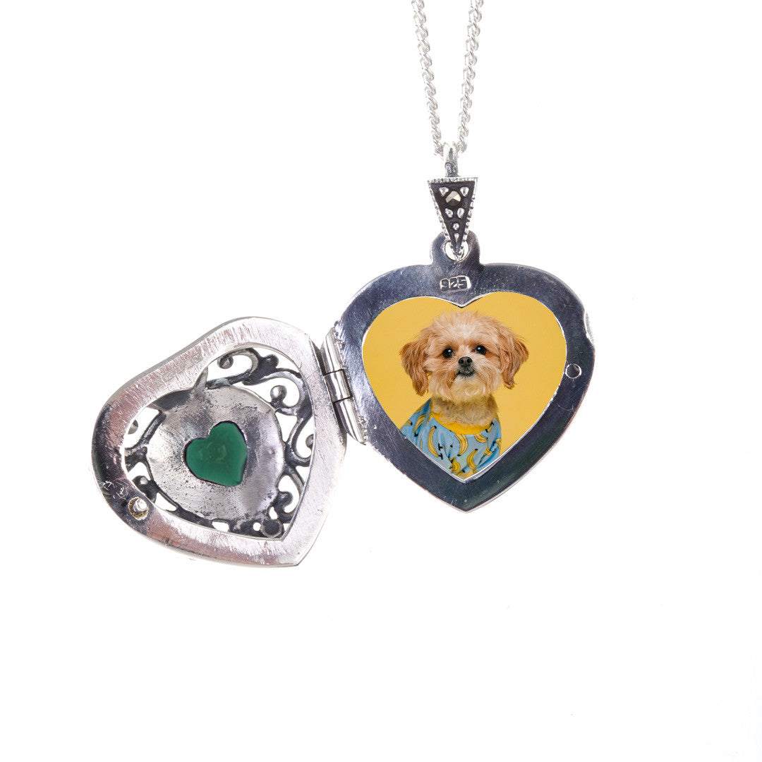 opened emerald vintage heart locket in silver with photo of dog inside