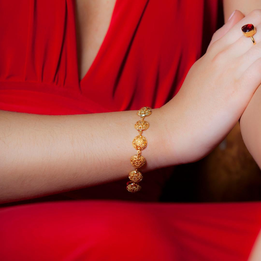 women modelling gold memory keeper bracelet