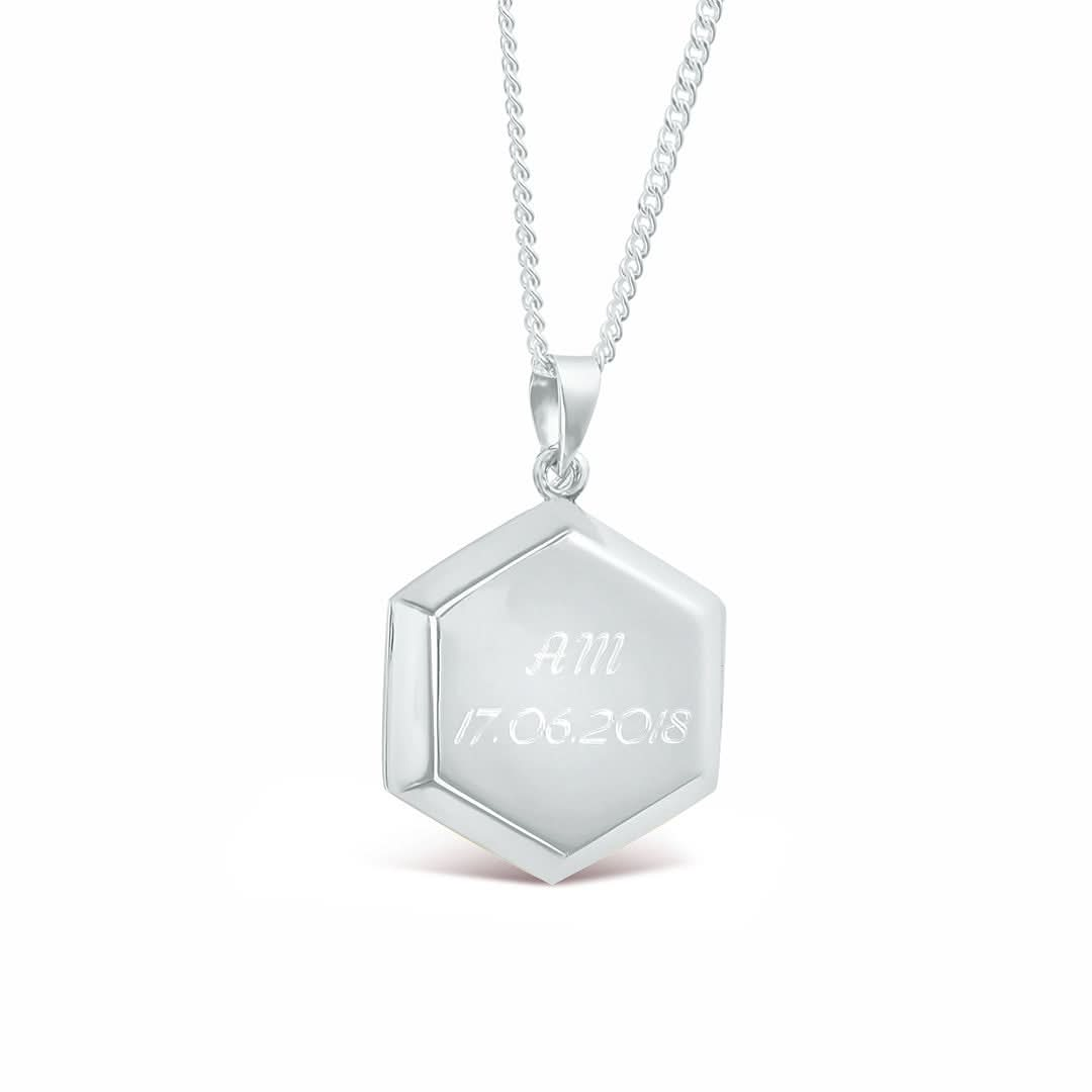 engraved hexagon locket in white gold on white background