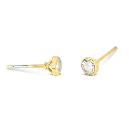 White quartz mini stud earrings in gold facing the side