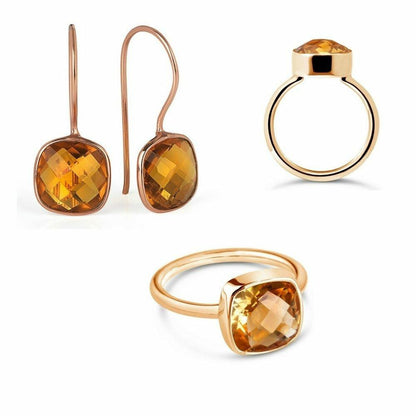citrine earrings in rose gold with cocktail ring on a whit background