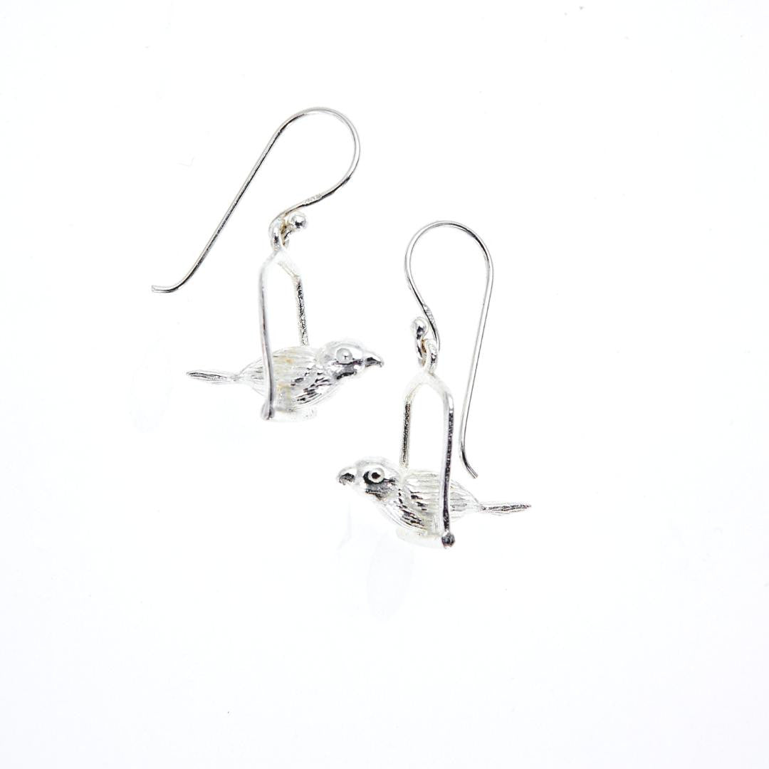 love bird earrings on a white background