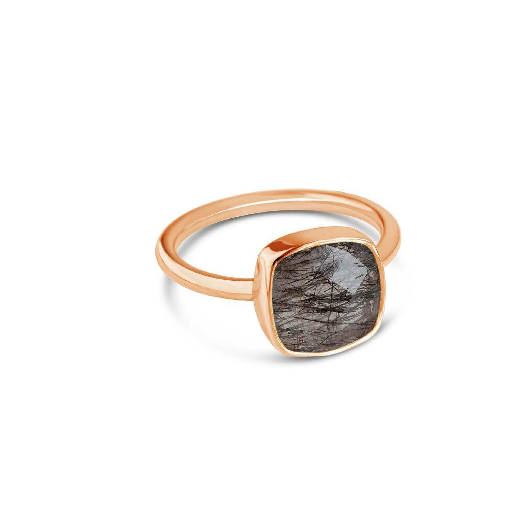 rutilated quartz cocktail ring in rose gold on a white background