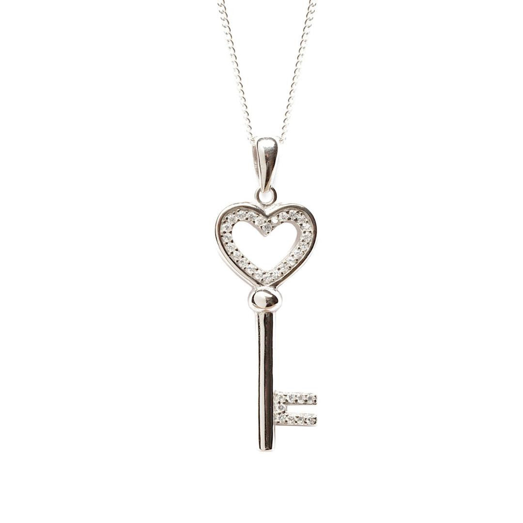 love key pendant in silver on a white background