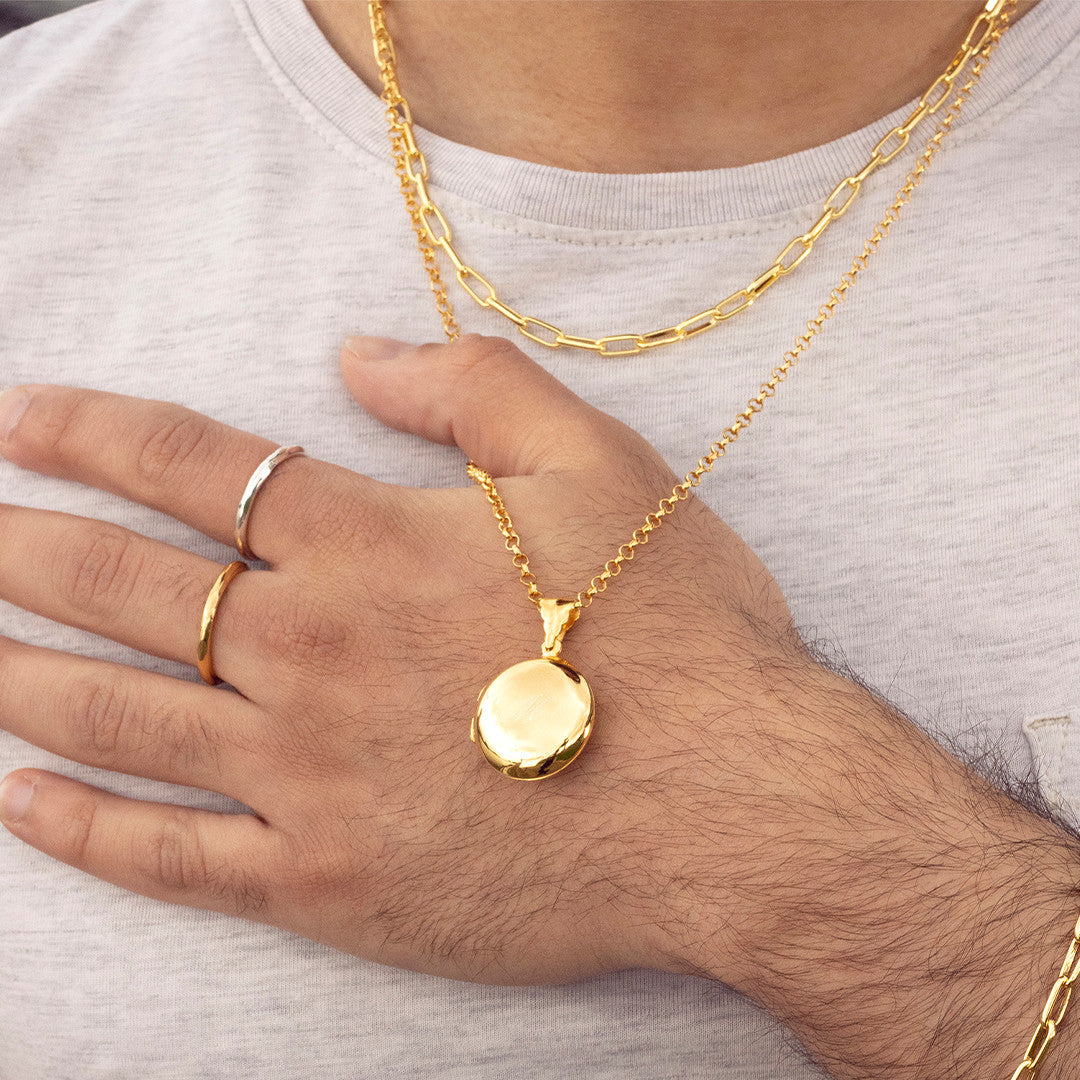 model wearing men's round locket necklace in gold
