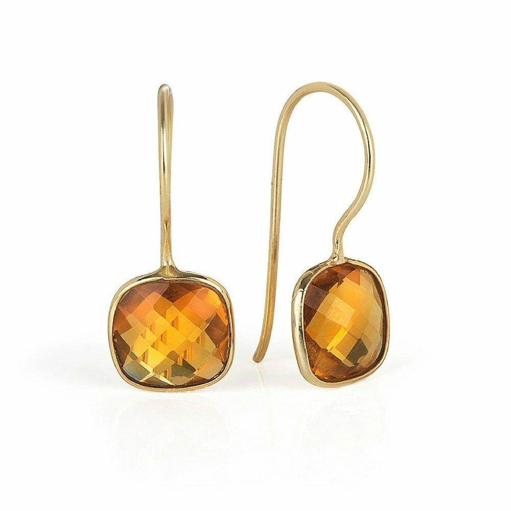 citrine earrings in gold on a white background