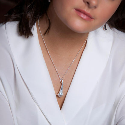 model wearing lily necklace