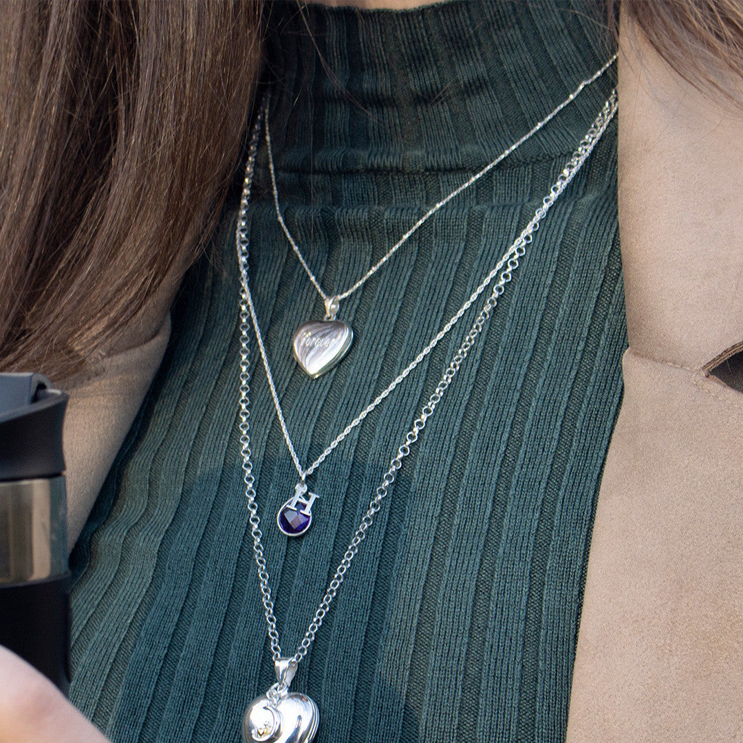 close up of model wearing secret silver heart locket