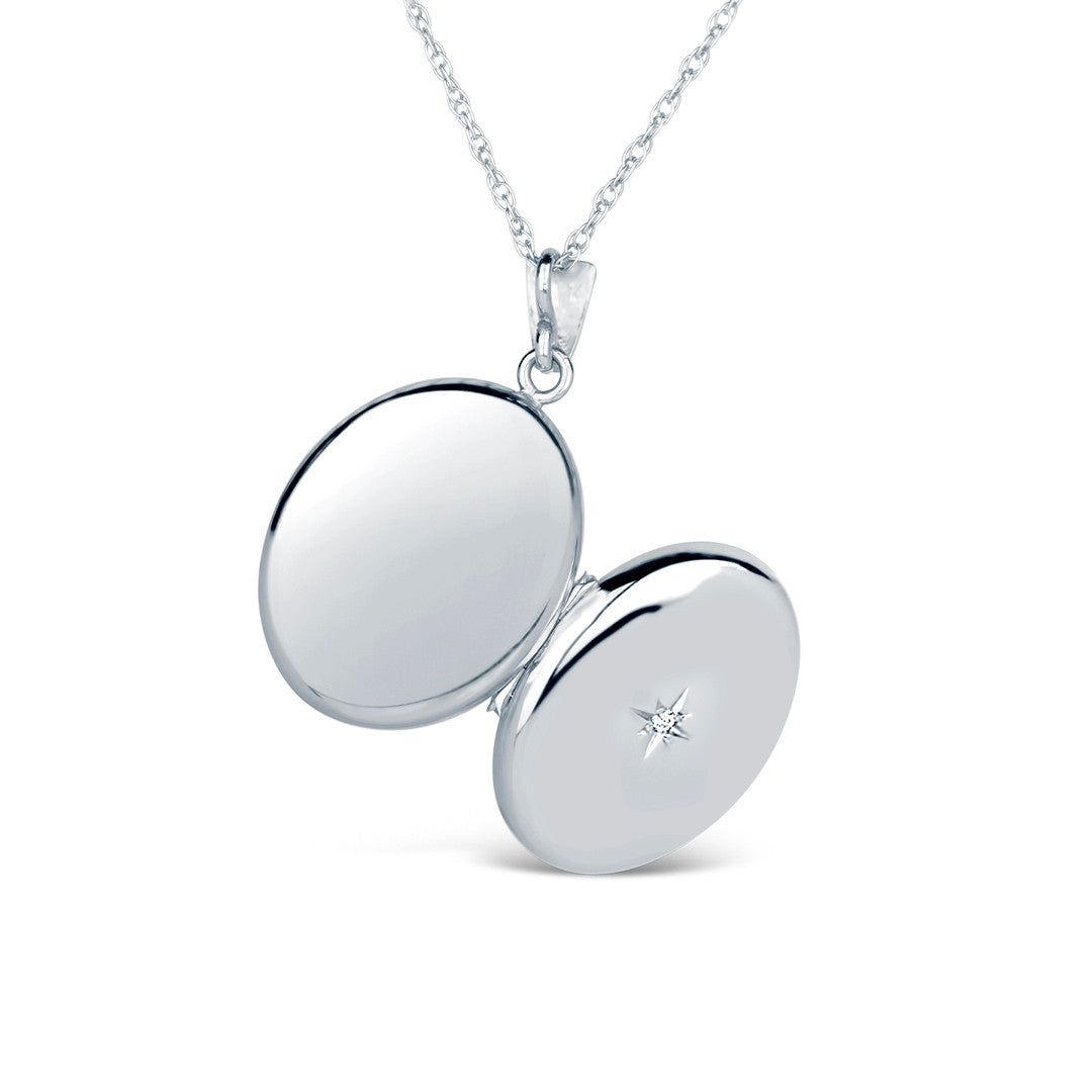opened diamond oval locket in white gold showing back and front of locket