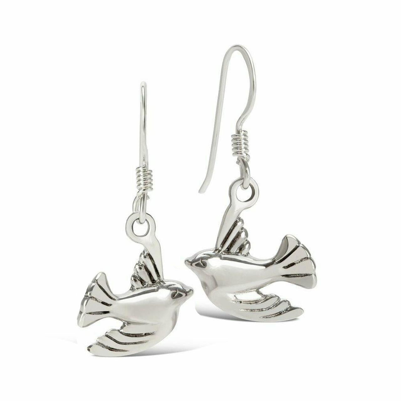 silver bird earrings on a white background