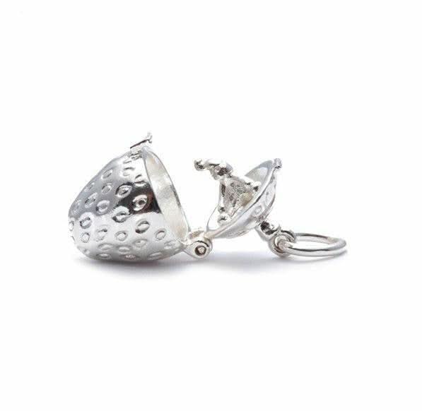 opened magical strawberry charm on a white background 
