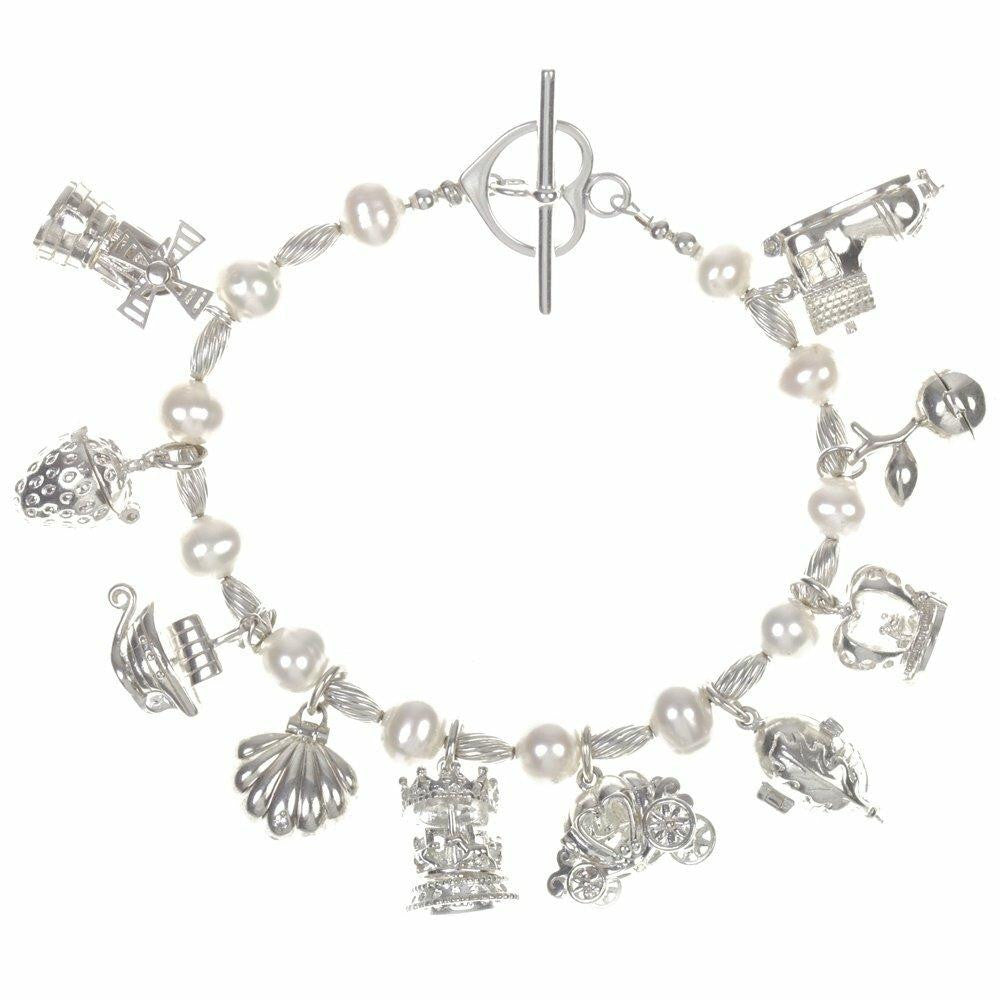 pearl charm bracelet in ivory silver with ten magical charms attached