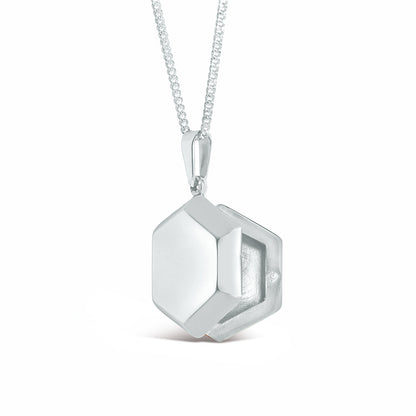 opened hexagon locket in white gold on a white background