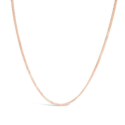 rose gold curb chain on a white background