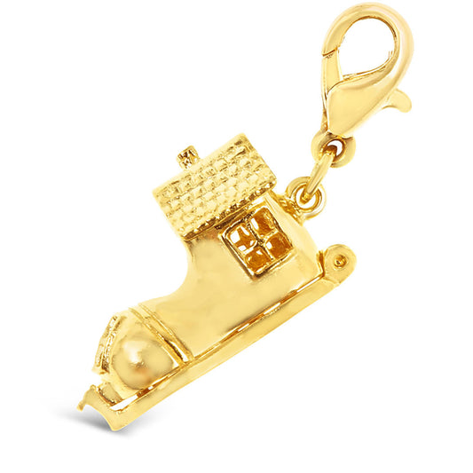 magical gold boot charm on a white background