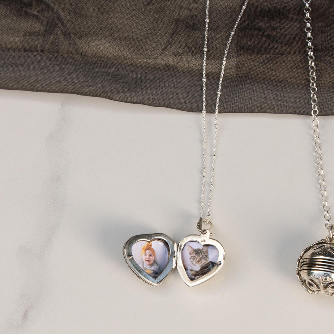 white gold beaded chain with white gold vintage style heart locket and two photos