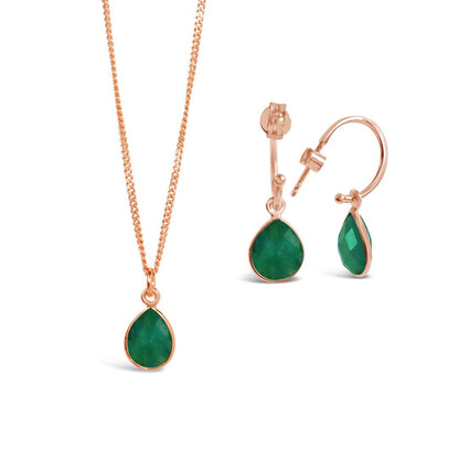 emerald charm necklace and drop hoop earrings in rose gold on a white background
