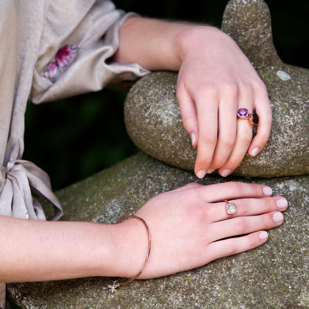 model wearing purple amethyst cocktail rings in silver