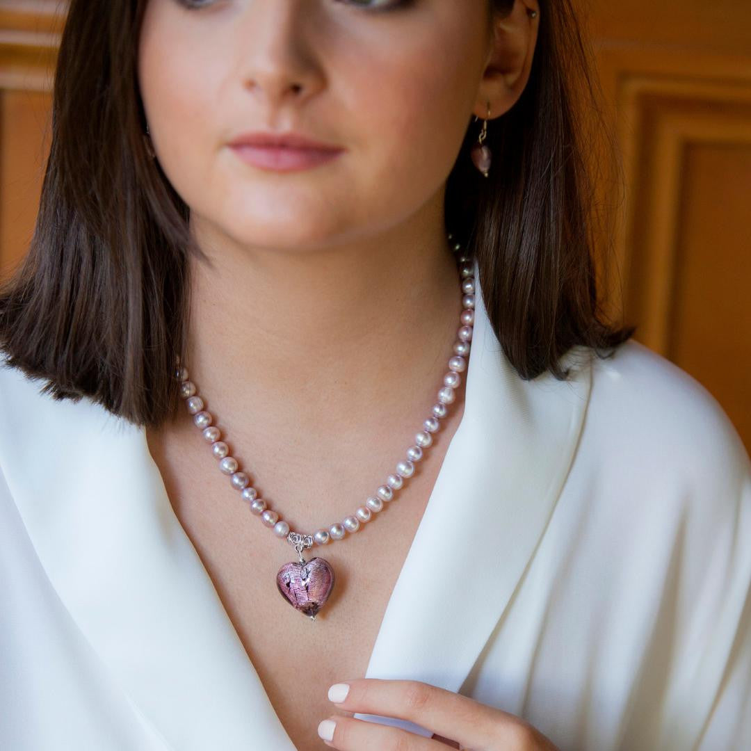 model wearing dusk pearl heart necklace and earrings
