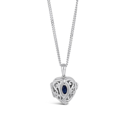 sapphire heart locket in silver on a white background