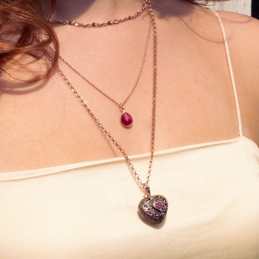 rose gold vintage heart locket necklace layered with a rose gold pendant