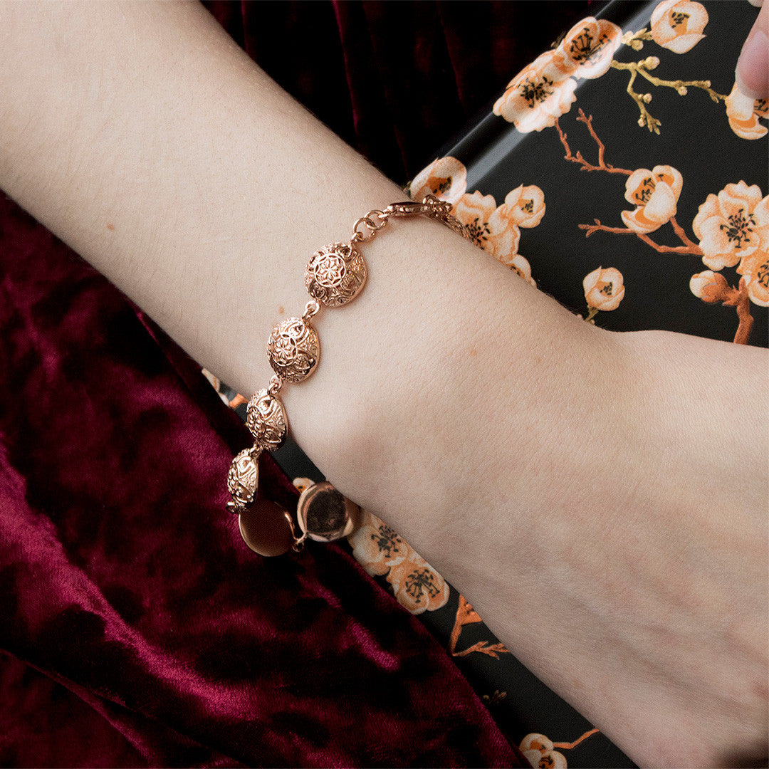 close up of model wearing rose gold memory keeper bracelet