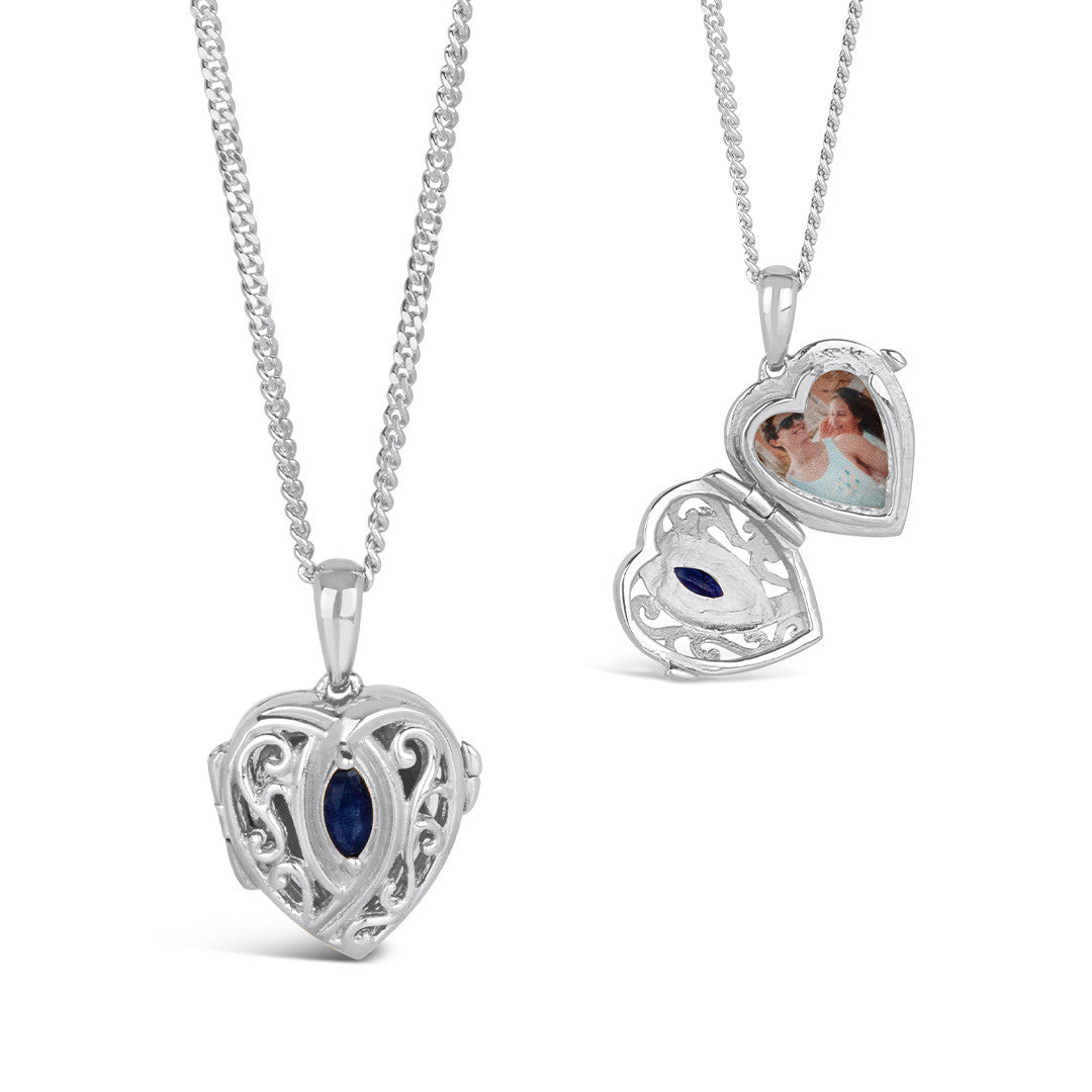 sapphire heart locket in silver with inside and outside view of locket