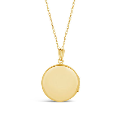 back of gold round diamond locket on white background