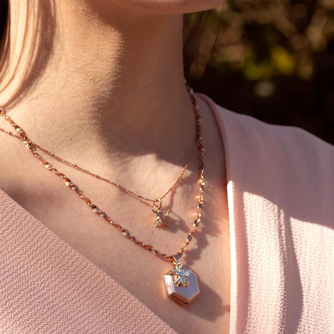 model wearing photo locket in rose gold