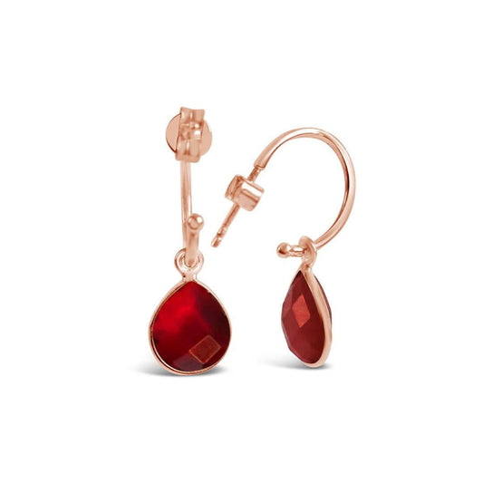 garnet drop hoop earrings in rose gold on a white background