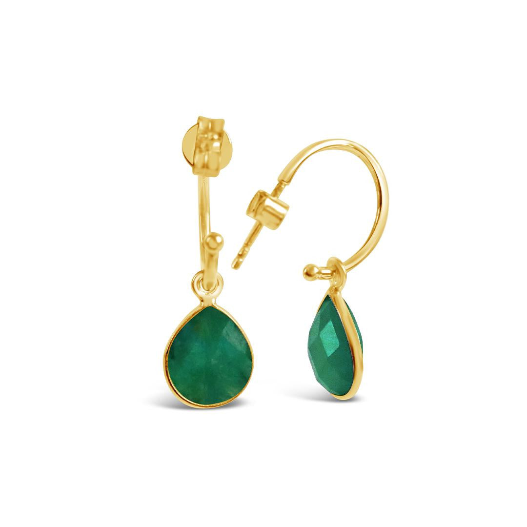 gold emerald drop hoop earrings on a white background
