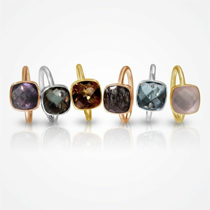 multiple cocktail rings with different gemstones