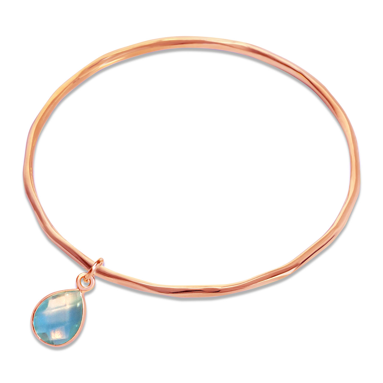 blue topaz charm bangle in rose gold on a white background