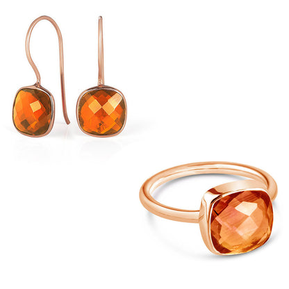 carnelian cocktail ring and luminous earrings in rose gold on a white background