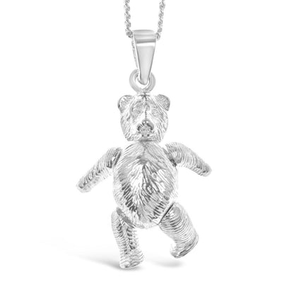 Deatail of large sterling silver fully jointed teddy bear pendant fully jointed on silver curb chain