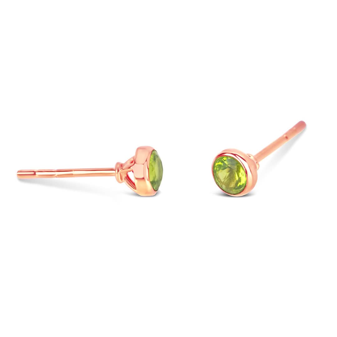peridot mini stud earrings in rose gold on a white background