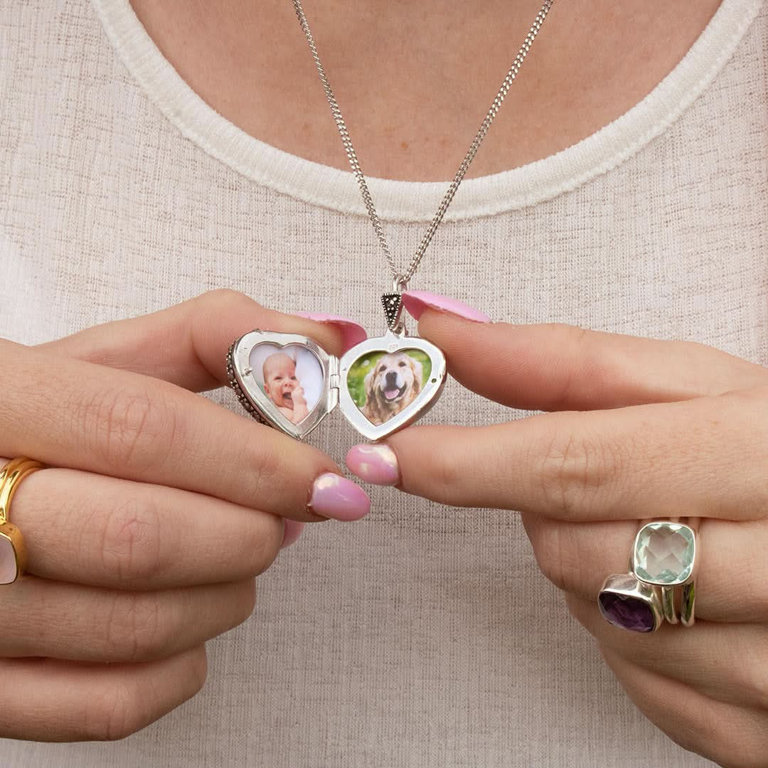 model wearing sterling silver curb chain with vintage heart locket and two photos inside