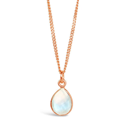 moonstone charm necklace in rose gold on a white background 