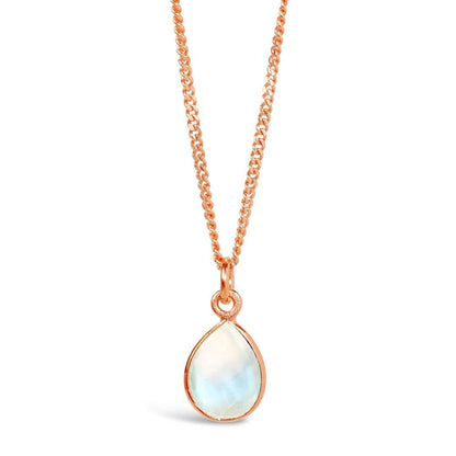 moonstone charm necklace in rose gold on a white background 