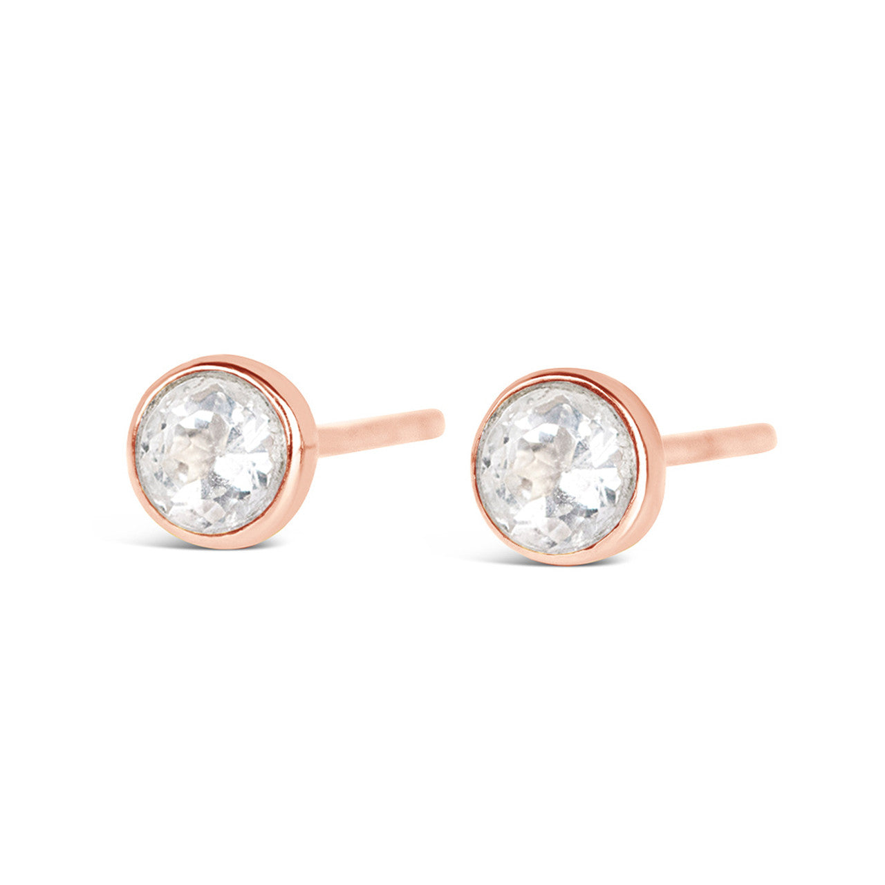 White quartz mini studs in rose gold facing the front on a white background