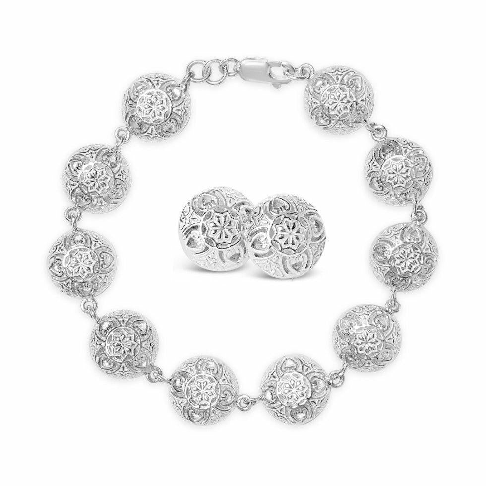 memory keeper bracelet and earrings in silver on a white background