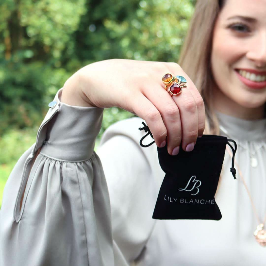 model holding black anti-tarnish pouch