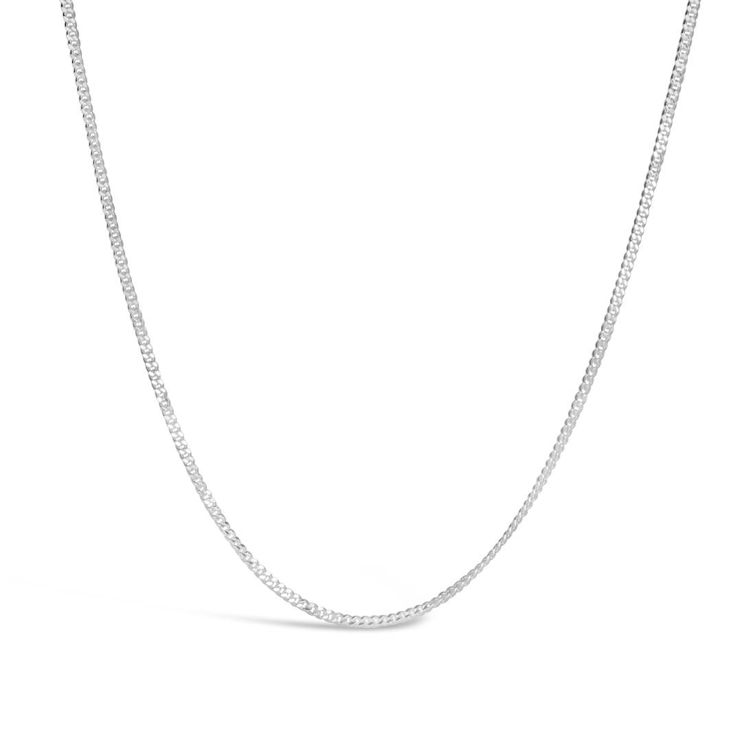 sterling silver curb chain on a white background