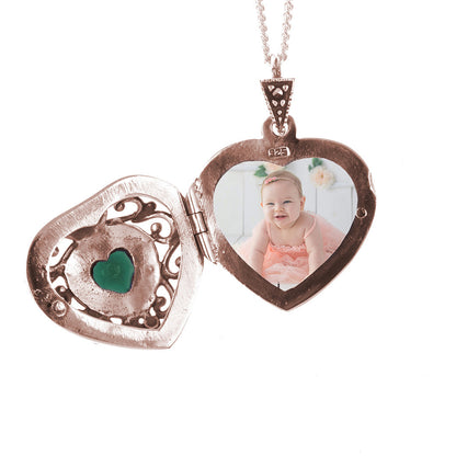 opened emerald vintage heart locket in rose gold with photo inside